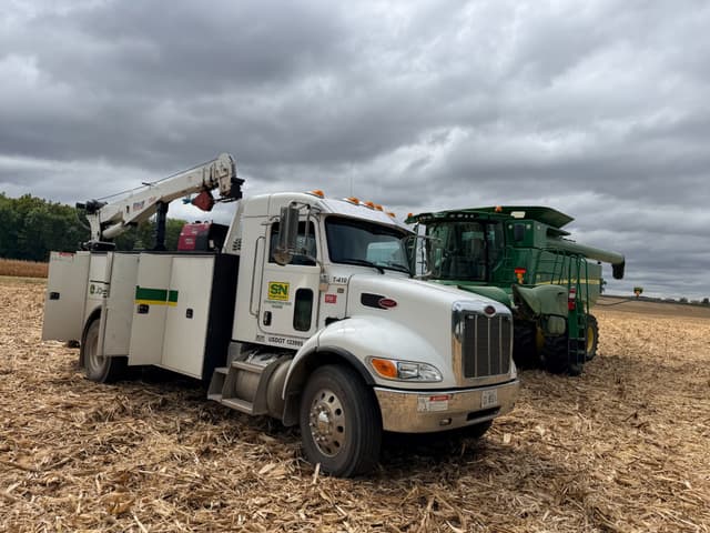 image snpartners service truck and john deere combine