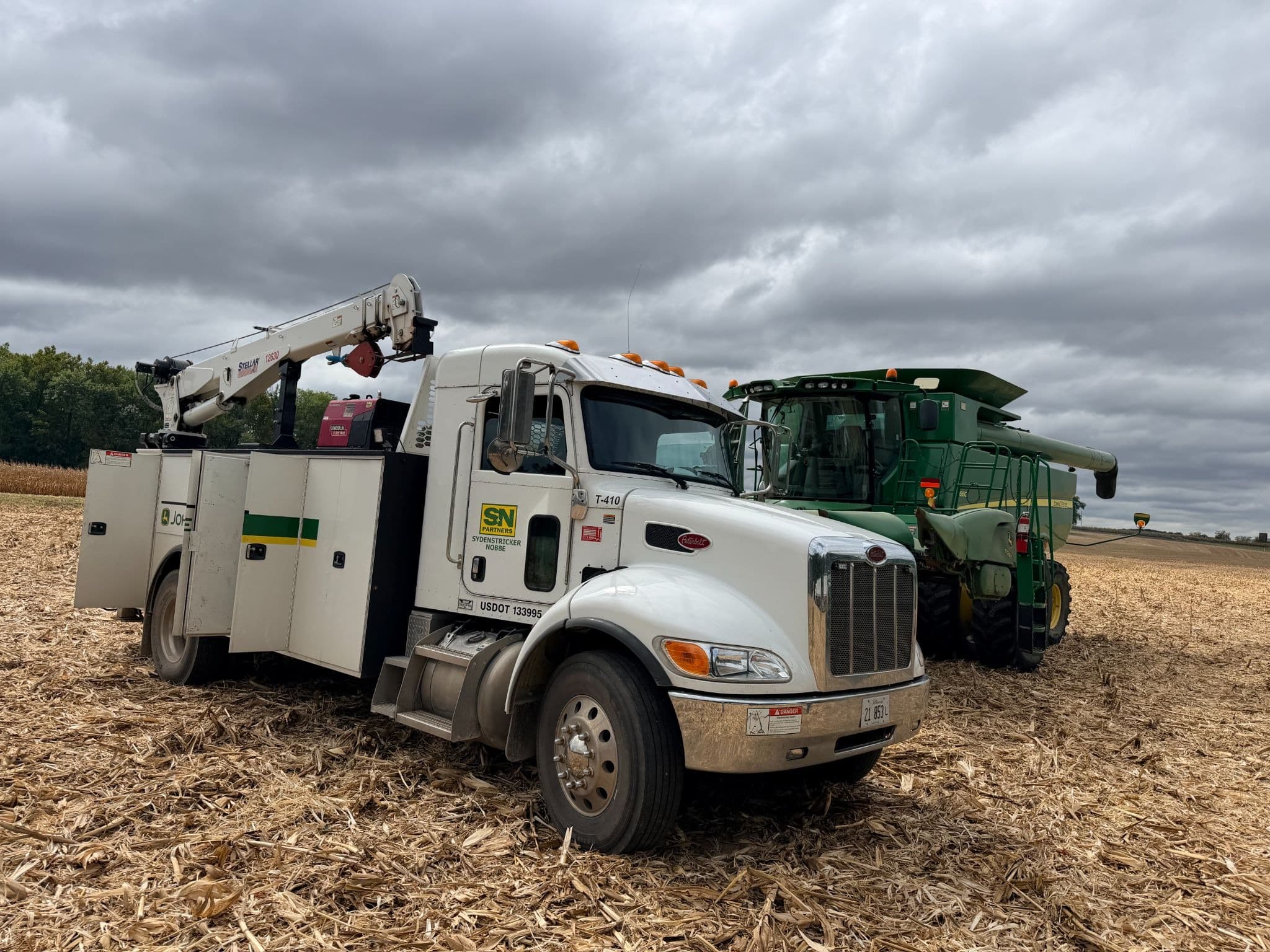 snpartners service truck and john deere combine